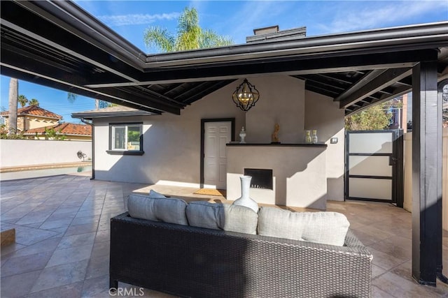4325 N Country Club Ln, Long Beach, CA 90807 - view of patio / terrace with an outdoor living space with a fireplace and fence