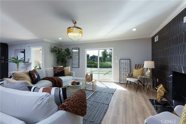 4325 N Country Club Ln, Long Beach, CA 90807 - living area with wood finished floors, recessed lighting, ornamental molding, baseboards, and a chandelier