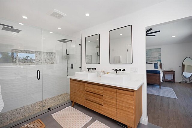 24132 Snipe Ln, Laguna Niguel, CA 92677 - bathroom with double vanity, wood finished floors, recessed lighting, and a shower stall
