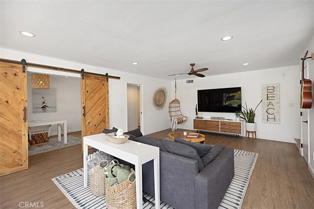 24132 Snipe Ln, Laguna Niguel, CA 92677 - living room featuring a barn door, ceiling fan, wood finished floors, and recessed lighting