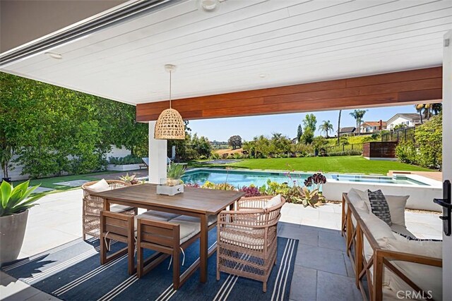 24132 Snipe Ln, Laguna Niguel, CA 92677 - view of patio / terrace with an outdoor pool and outdoor dining area
