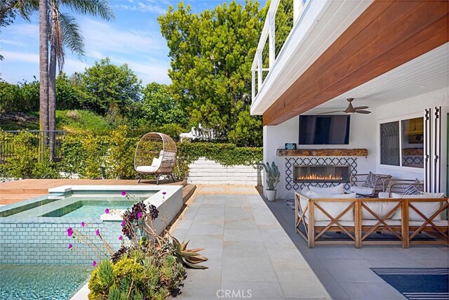 24132 Snipe Ln, Laguna Niguel, CA 92677 - view of patio with an outdoor living space with a fireplace and ceiling fan