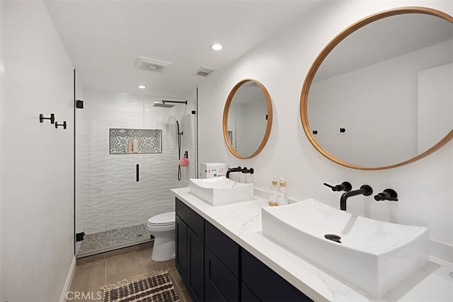24132 Snipe Ln, Laguna Niguel, CA 92677 - full bathroom featuring toilet, a shower stall, recessed lighting, and double vanity