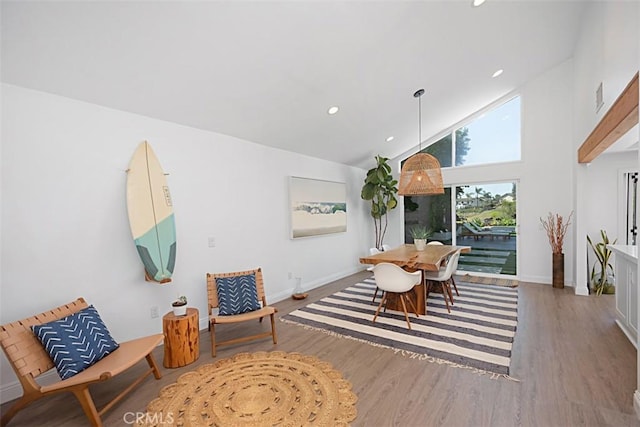 24132 Snipe Ln, Laguna Niguel, CA 92677 - dining area featuring wood finished floors, high vaulted ceiling, baseboards, and recessed lighting