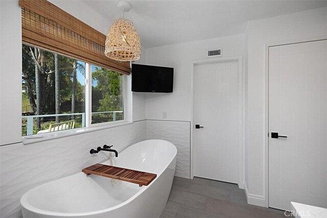 24132 Snipe Ln, Laguna Niguel, CA 92677 - full bathroom with a soaking tub and tile walls