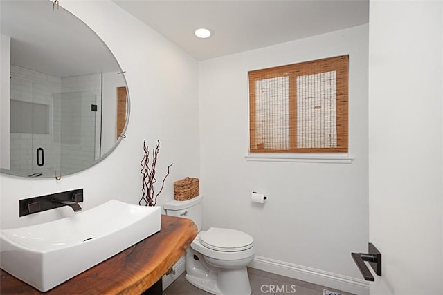 24132 Snipe Ln, Laguna Niguel, CA 92677 - full bath with toilet, a sink, a shower stall, baseboards, and tile patterned flooring
