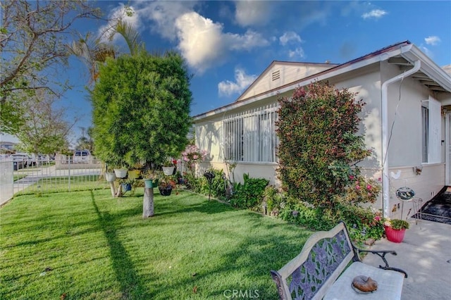 1419 S Hesperian St, Santa Ana, CA 92704 - view of side of home featuring stucco siding