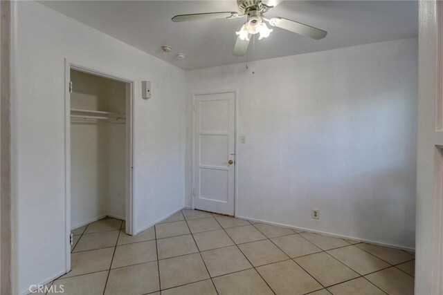1419 S Hesperian St, Santa Ana, CA 92704 - unfurnished bedroom featuring light tile patterned floors, a closet, ceiling fan, and baseboards