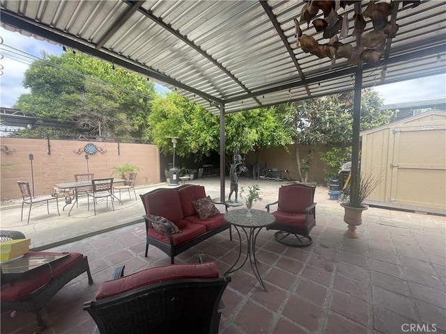 3641 E Elizabeth St, Compton, CA 90221 - fenced backyard featuring outdoor dining area, a storage shed, a patio area, and an outdoor living space
