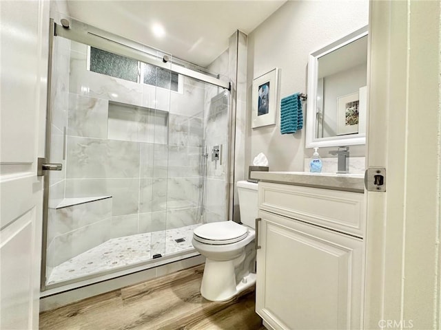 24082 Calendula, Mission Viejo, CA 92692 - bathroom featuring toilet, a shower stall, vanity, and wood finished floors