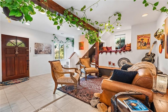 living room with recessed lighting, light tile patterned floors, and baseboards