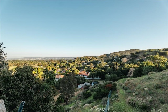 aerial overview of property's location featuring a mountain backdrop