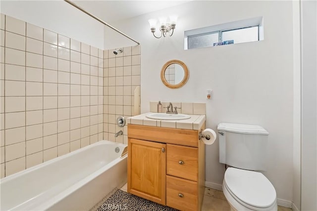 bathroom with toilet, shower / tub combination, vanity, and tile patterned floors
