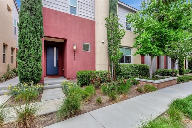 10561 Cannon Dr, Rancho Cucamonga, CA 91730 - entrance to property featuring stucco siding