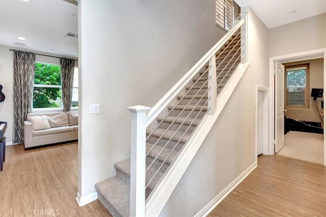 10561 Cannon Dr, Rancho Cucamonga, CA 91730 - stairs with wood finished floors and baseboards