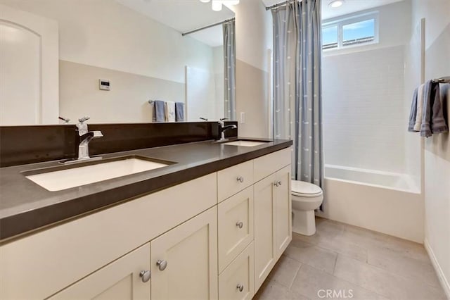 10561 Cannon Dr, Rancho Cucamonga, CA 91730 - bathroom featuring tile patterned floors, toilet, double vanity, and shower / bath combo with shower curtain