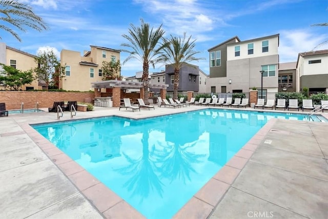 10561 Cannon Dr, Rancho Cucamonga, CA 91730 - community pool with fence, a residential view, a patio area, and a pergola