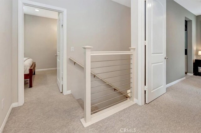 10561 Cannon Dr, Rancho Cucamonga, CA 91730 - corridor featuring an upstairs landing, carpet flooring, and baseboards