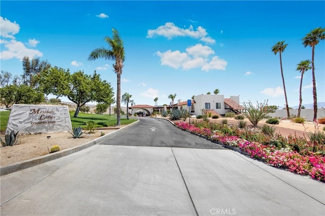 9653 Spyglass Ave Unit 99, Desert Hot Springs, CA 92240 - view of concrete road with curbs and a residential view