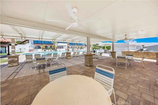 9653 Spyglass Ave Unit 99, Desert Hot Springs, CA 92240 - view of patio with outdoor dining space and ceiling fan