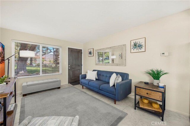 9653 Spyglass Ave Unit 99, Desert Hot Springs, CA 92240 - living room featuring plenty of natural light and baseboards
