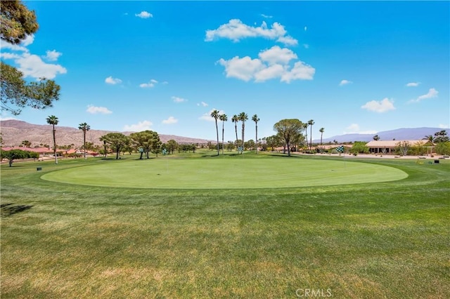9653 Spyglass Ave Unit 99, Desert Hot Springs, CA 92240 - view of community featuring a mountain view, an area to practice putting, and golf course view