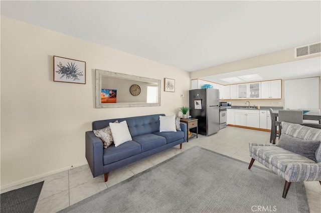 9653 Spyglass Ave Unit 99, Desert Hot Springs, CA 92240 - living area featuring baseboards and light tile patterned floors