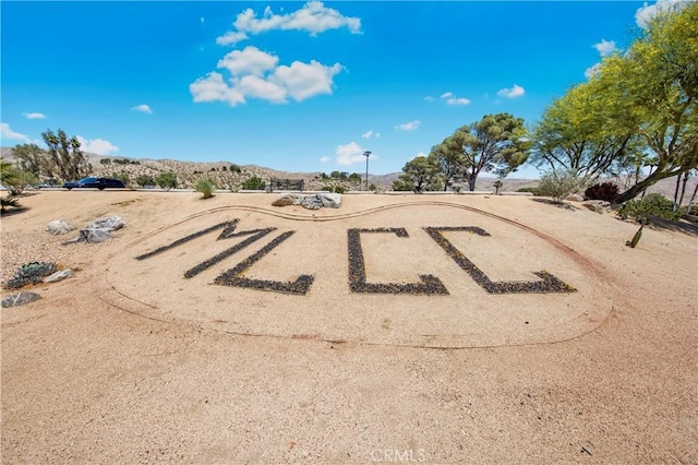 9653 Spyglass Ave Unit 99, Desert Hot Springs, CA 92240 - view of community with uncovered parking and a mountain view