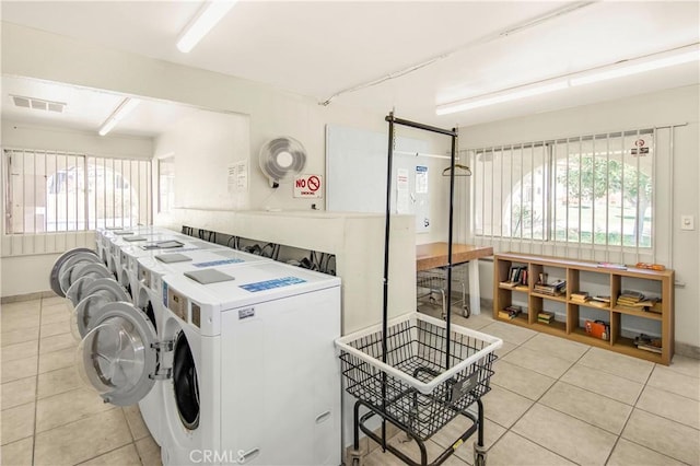 9653 Spyglass Ave Unit 99, Desert Hot Springs, CA 92240 - shared laundry room featuring light tile patterned floors and independent washer and dryer