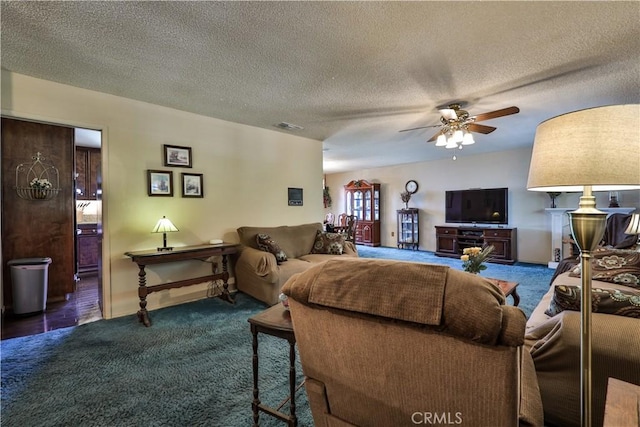 22972 Valley View Dr, Crestline, CA 92325 - carpeted living room with a ceiling fan, a textured ceiling, and baseboards