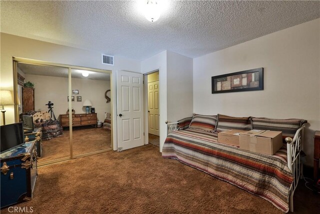 22972 Valley View Dr, Crestline, CA 92325 - bedroom with carpet floors, a textured ceiling, and a closet
