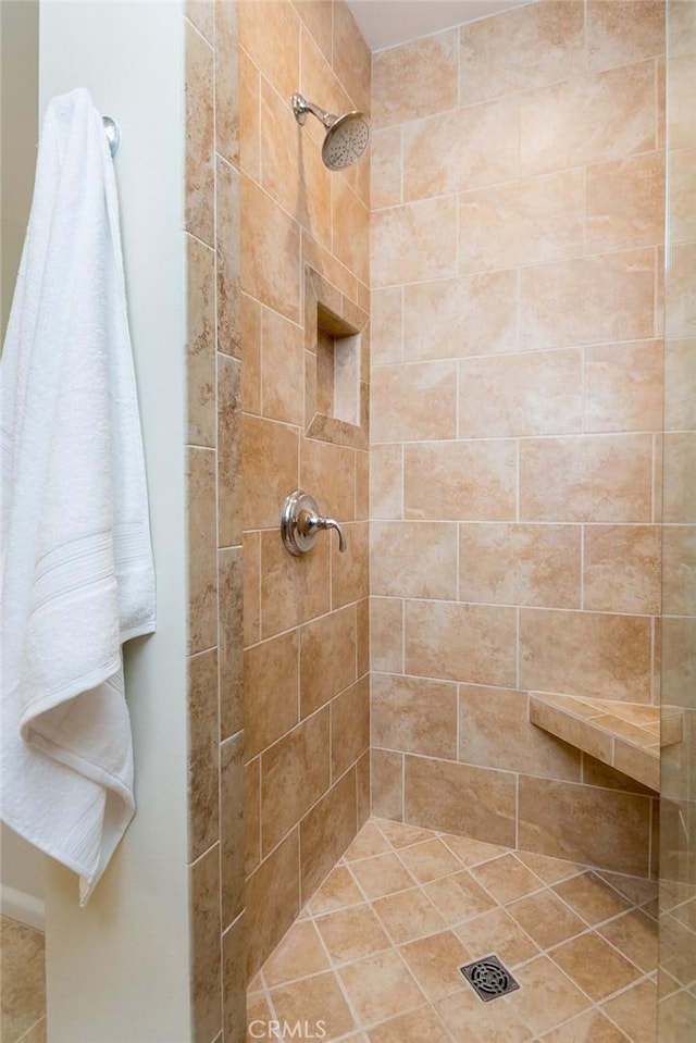 full bath featuring tiled shower