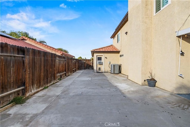 10213 Single Oak Dr, Bakersfield, CA 93311 - view of patio / terrace with a fenced backyard and central air condition unit