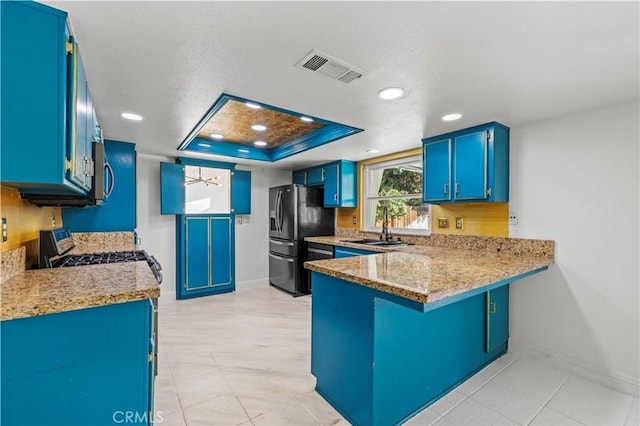10213 Single Oak Dr, Bakersfield, CA 93311 - kitchen featuring appliances with stainless steel finishes, blue cabinetry, a sink, baseboards, and recessed lighting