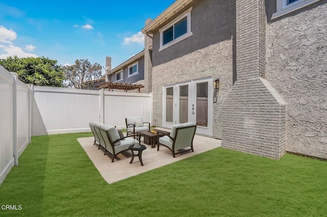 1314 Gina Dr, Oxnard, CA 93030 - rear view of property featuring a fenced backyard, stucco siding, outdoor lounge area, and a patio