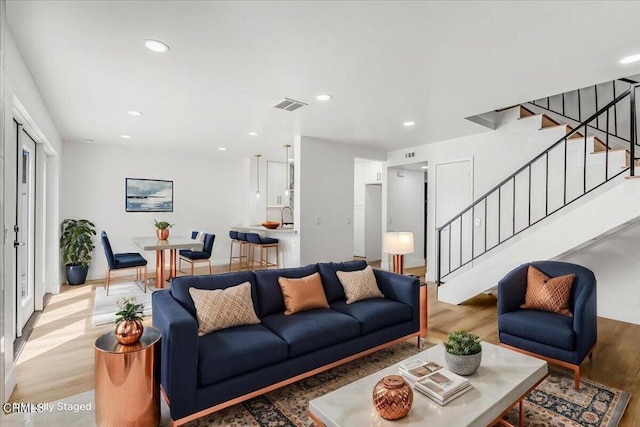 1314 Gina Dr, Oxnard, CA 93030 - living room with wood finished floors, stairway, and recessed lighting