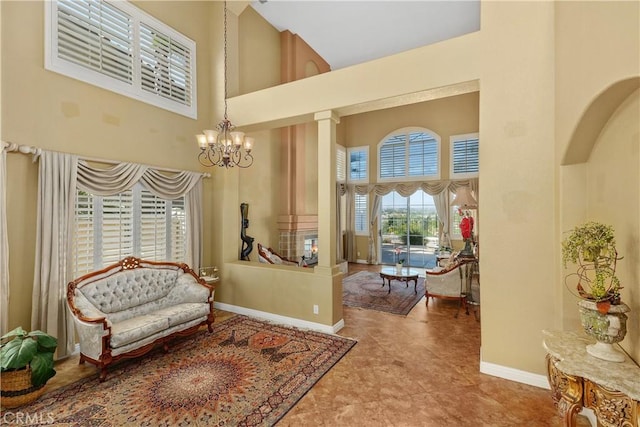 44886 Camino Veste, Temecula, CA 92592 - sitting room with high vaulted ceiling, a chandelier, and baseboards