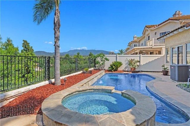 44886 Camino Veste, Temecula, CA 92592 - view of pool featuring a mountain view, cooling unit, a fenced backyard, and a pool with connected hot tub