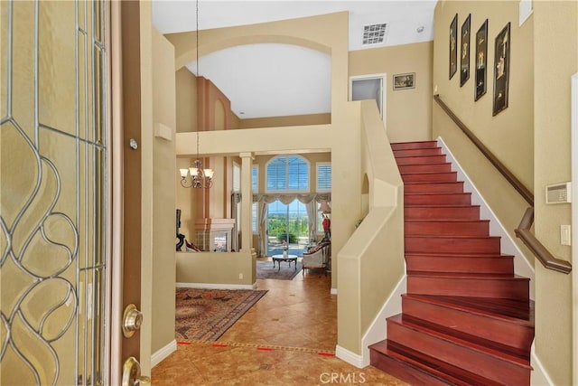 44886 Camino Veste, Temecula, CA 92592 - foyer featuring stairs, a high ceiling, baseboards, a chandelier, and tile patterned flooring