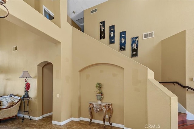 44886 Camino Veste, Temecula, CA 92592 - stairway with a high ceiling, arched walkways, and baseboards