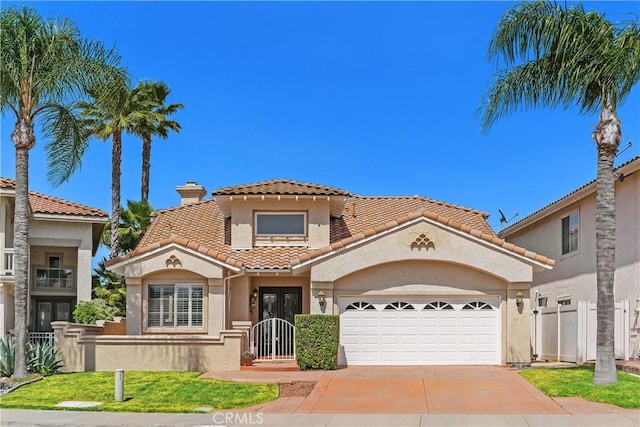 44886 Camino Veste, Temecula, CA 92592 - mediterranean / spanish home featuring an attached garage, stucco siding, driveway, a tile roof, and fence