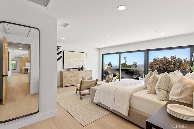 820 Calle Mendoza, San Clemente, CA 92672 - bedroom featuring attic access, multiple windows, light wood-type flooring, recessed lighting, and baseboards