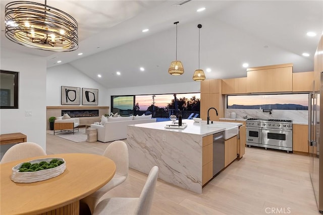 820 Calle Mendoza, San Clemente, CA 92672 - kitchen with stainless steel appliances, a sink, high vaulted ceiling, light brown cabinets, and modern cabinets