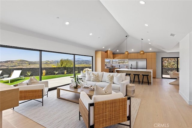 820 Calle Mendoza, San Clemente, CA 92672 - living room featuring plenty of natural light, lofted ceiling, recessed lighting, light wood-style floors, and a mountain view