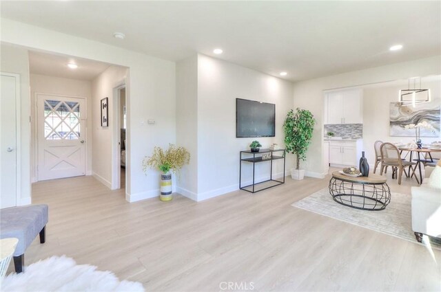 16928 Pocono St, La Puente, CA 91744 - living room with light wood-type flooring, baseboards, and recessed lighting