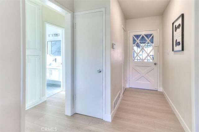 16928 Pocono St, La Puente, CA 91744 - hall with light wood-type flooring and baseboards