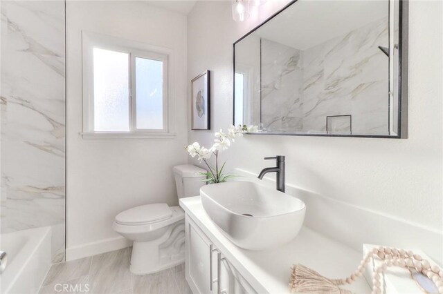 16928 Pocono St, La Puente, CA 91744 - full bathroom featuring toilet, vanity, and baseboards