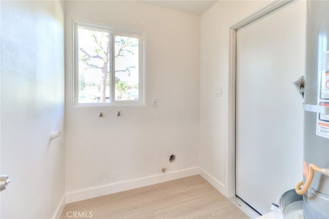 16928 Pocono St, La Puente, CA 91744 - laundry area featuring light wood-style floors and baseboards