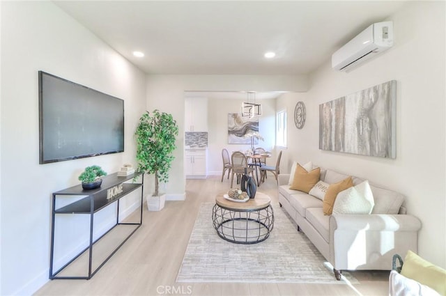 16928 Pocono St, La Puente, CA 91744 - living area with a wall unit AC, light wood-style floors, recessed lighting, and baseboards