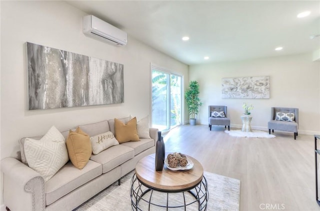 16928 Pocono St, La Puente, CA 91744 - living room with a wall unit AC, wood finished floors, baseboards, and recessed lighting